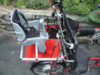 Baby rumble seat - cargo platform with infant seat above.
